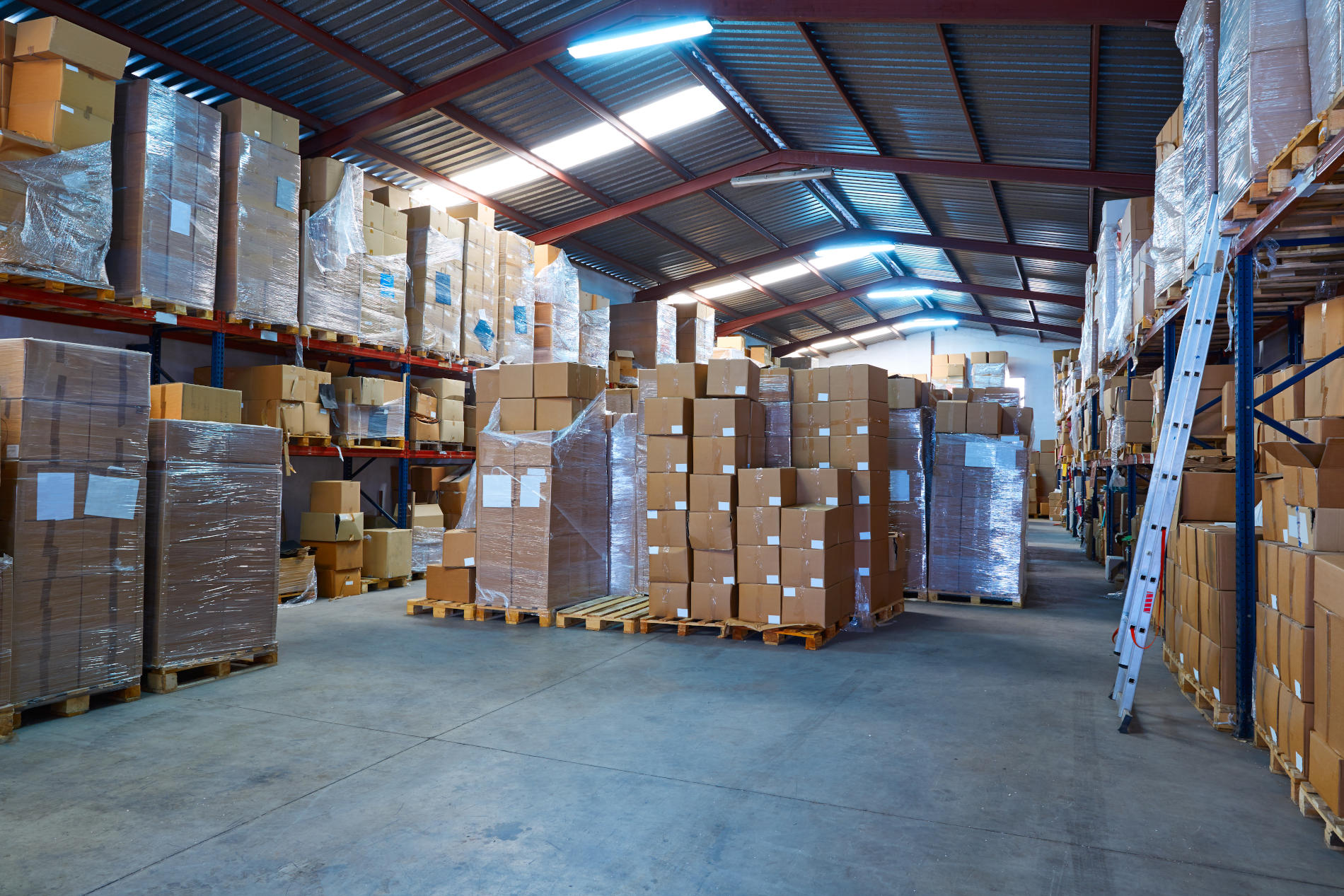 Warehouse stograge with stacked boxes in rows